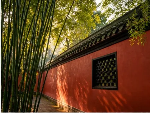 A red wall and bamboo near a Chengdu heritage site